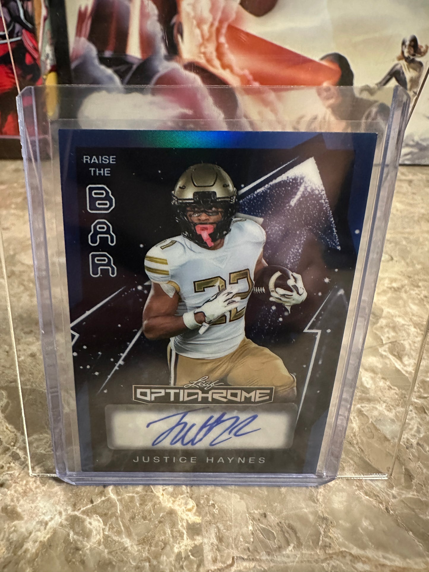 Justice Haynes 2026 Leaf Optichrome Football Raise the Bar Blue Prismatic Autograph /5
