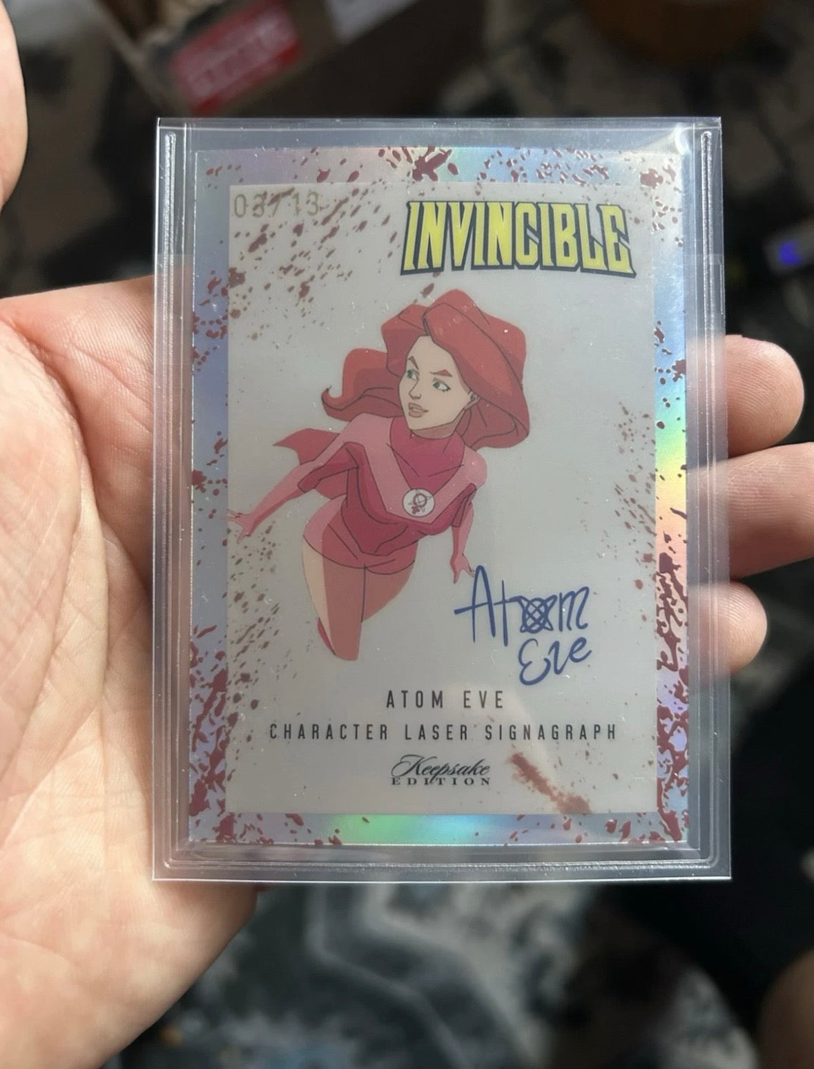 (2026/02/27) Keepsake Invincible Holo Atom Eve Laser Signagraph Blood Spatter 03/13