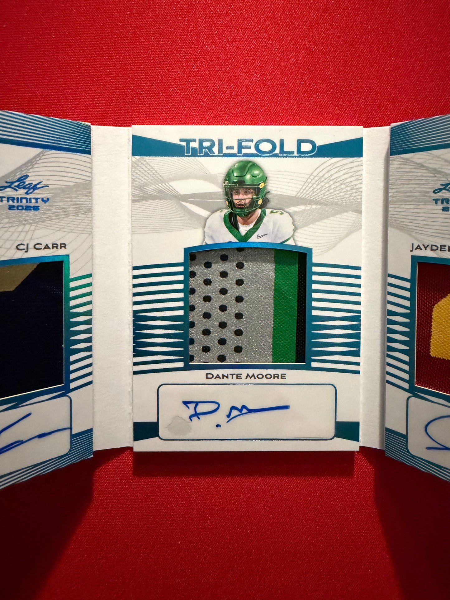 CJ Carr Dante Moore Maiava 2026 Leaf Trinity Football Tri-Fold Triple Patch Auto