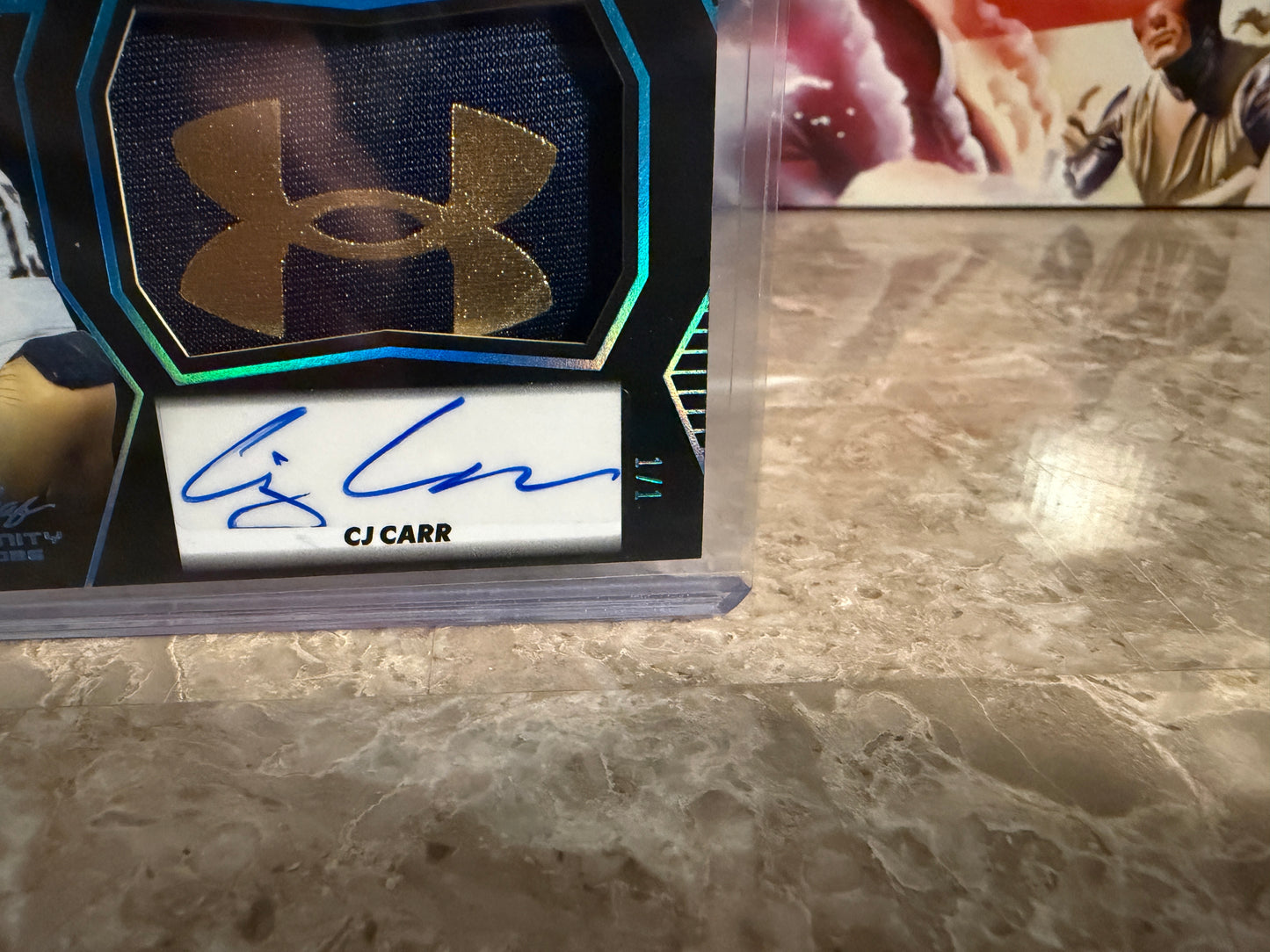CJ Carr 2026 Leaf Trinity Rookie Auto Mem Black Gold Under Armor Logo Patch 1/1