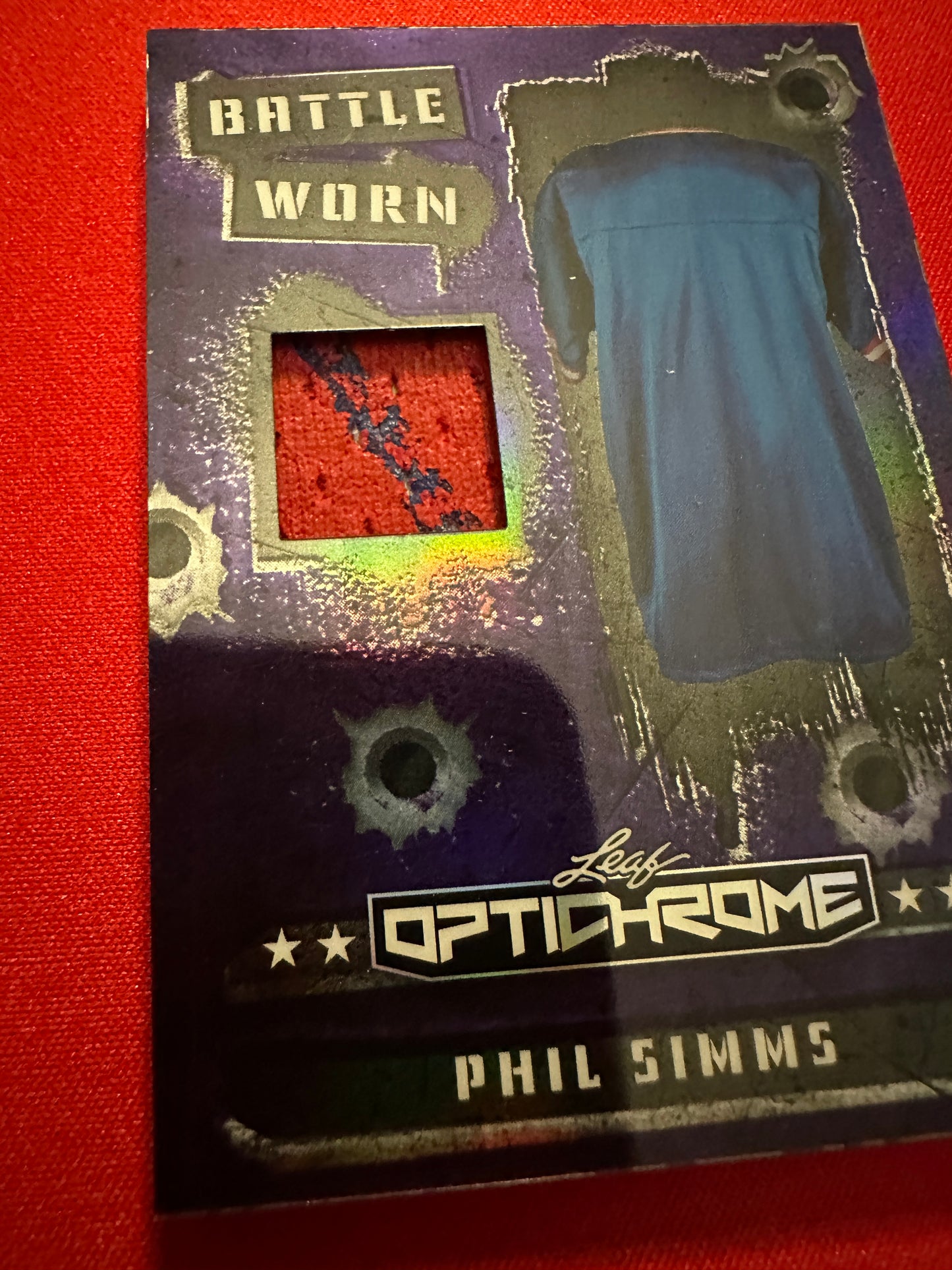 Phil Simms 2026 Leaf Optichrome Battle Worn Purple Prismatic Game-Used Patch /7