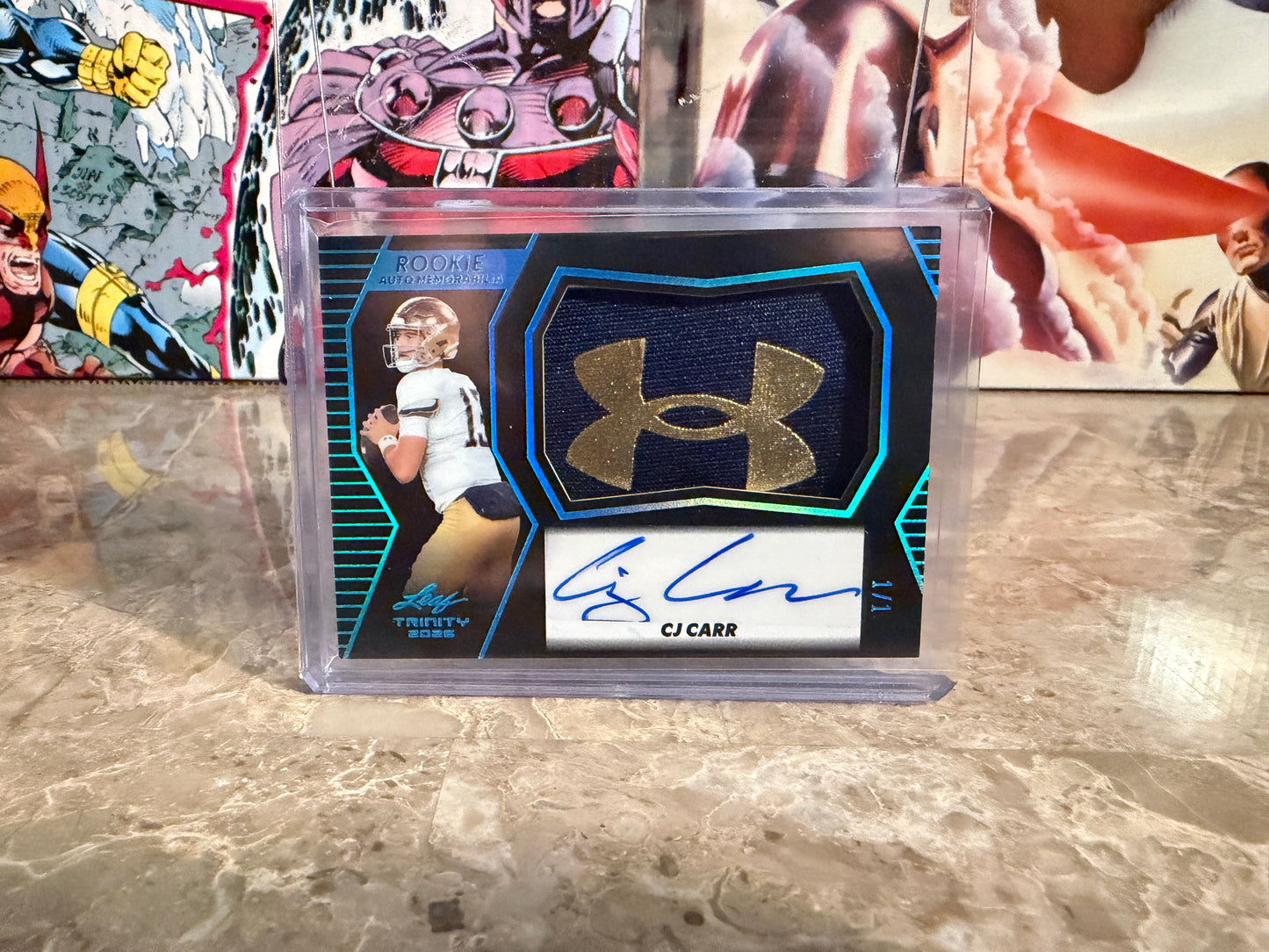 CJ Carr 2026 Leaf Trinity Rookie Auto Mem Black Gold Under Armor Logo Patch 1/1