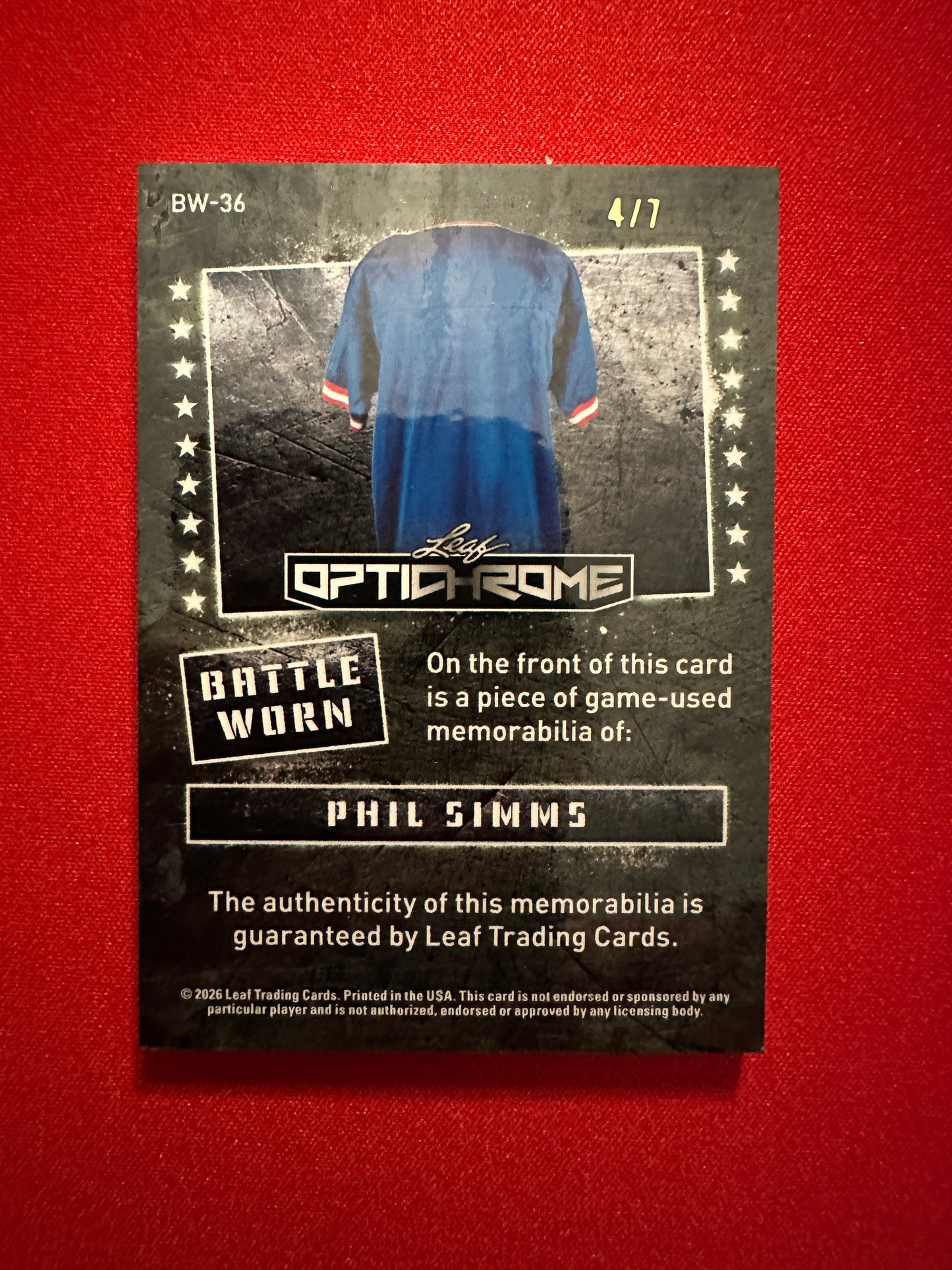 Phil Simms 2026 Leaf Optichrome Battle Worn Purple Prismatic Game-Used Patch /7